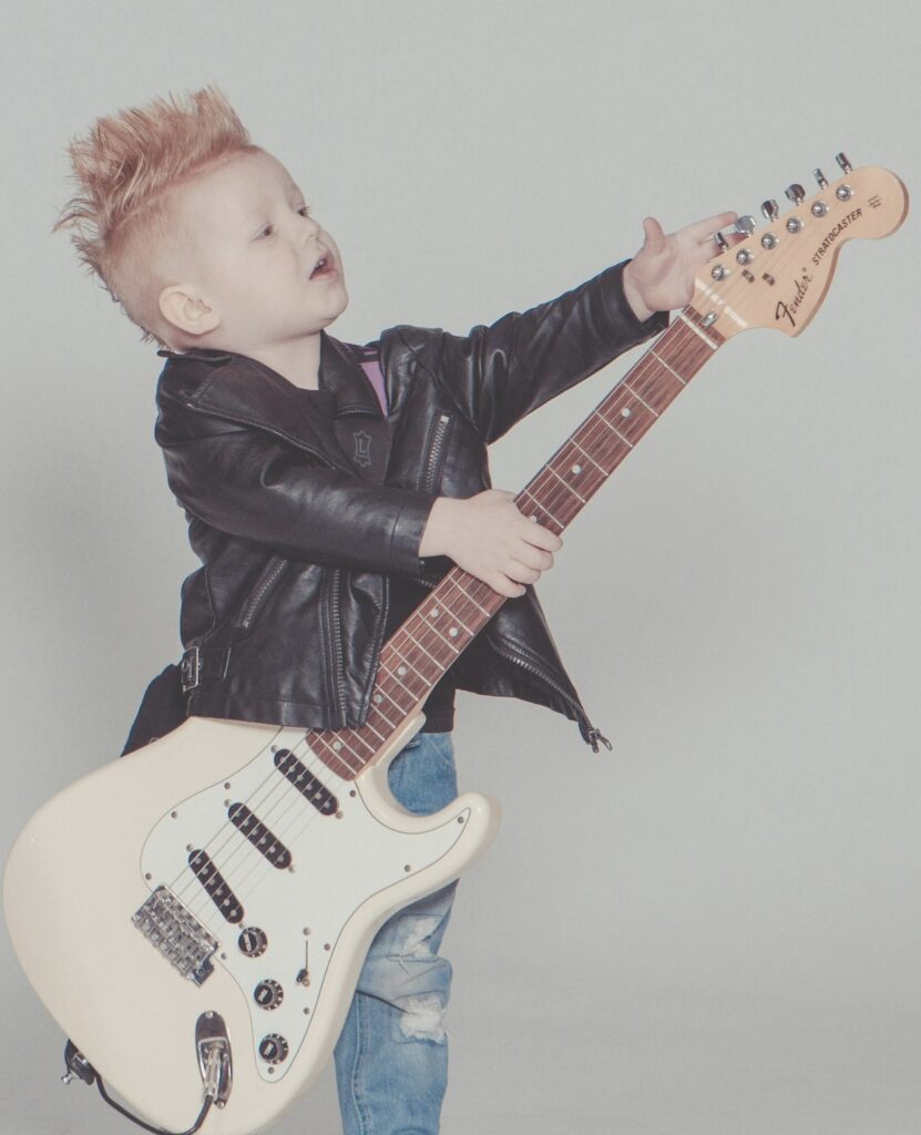 Child playing guitar